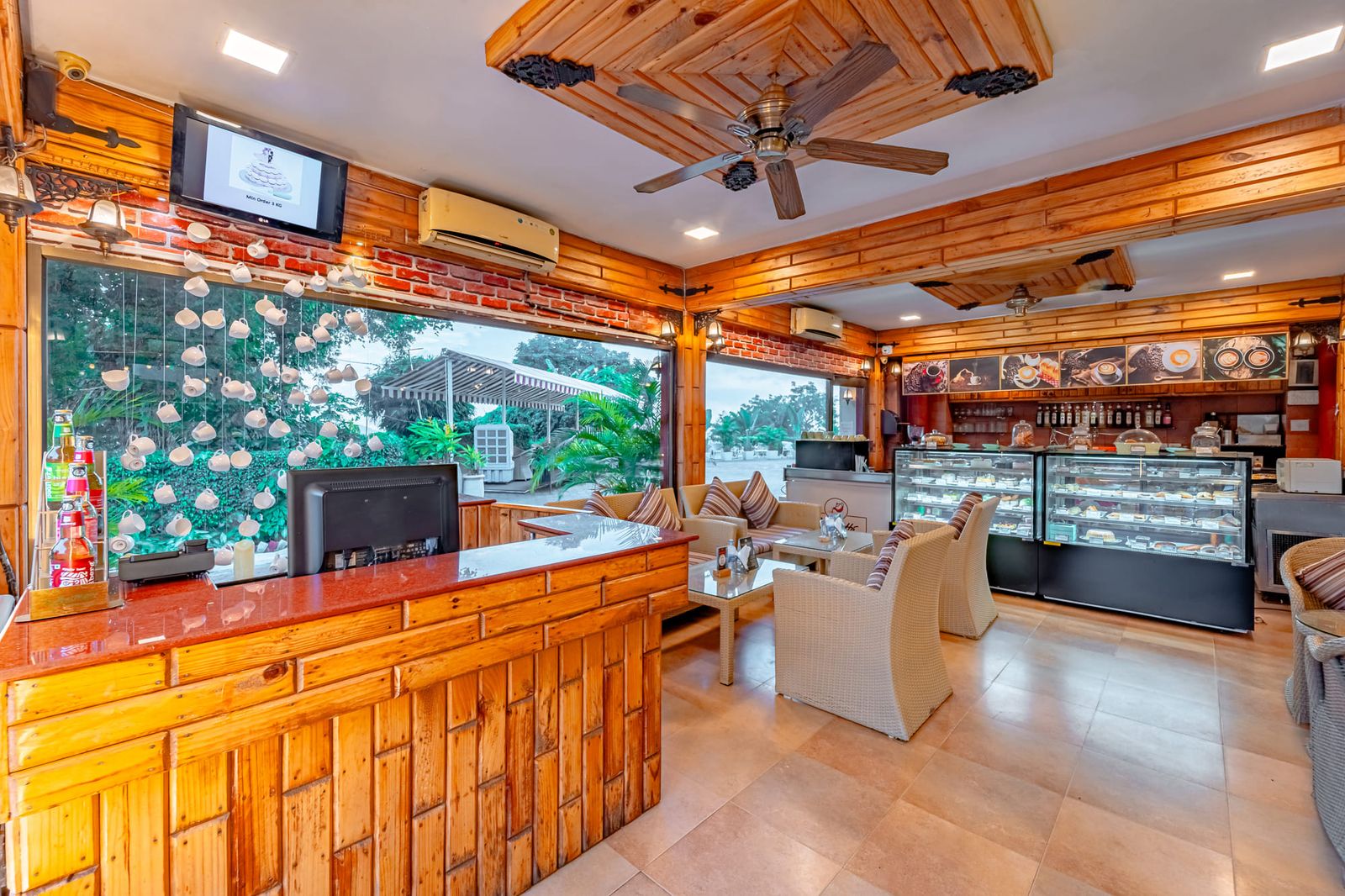 The coffee bar and glass pastry counter inside the café