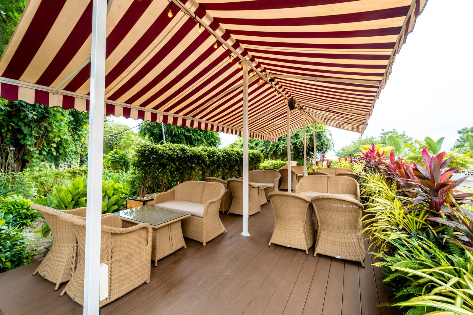 The awning terrace with cane chairs